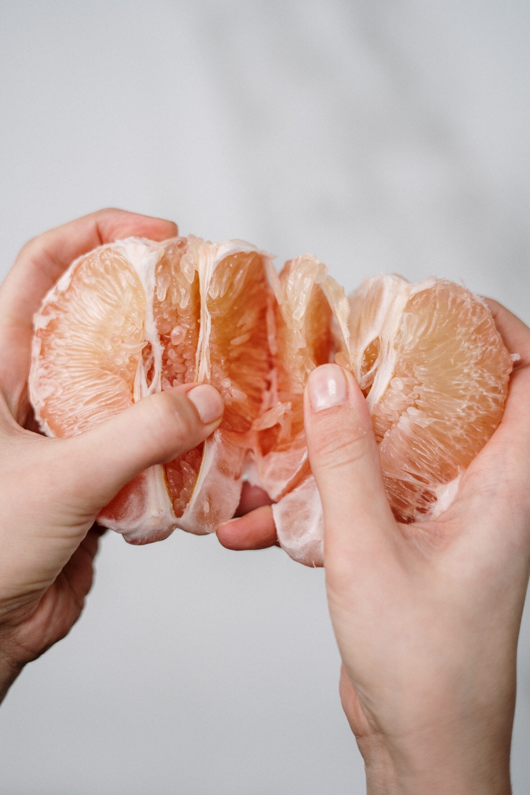 grapefruit hands woman